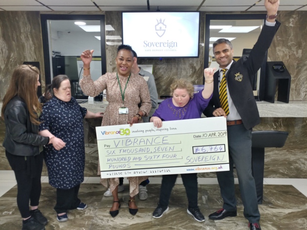 Vibrance Service users presented with the cheque from Goodmayes Manager